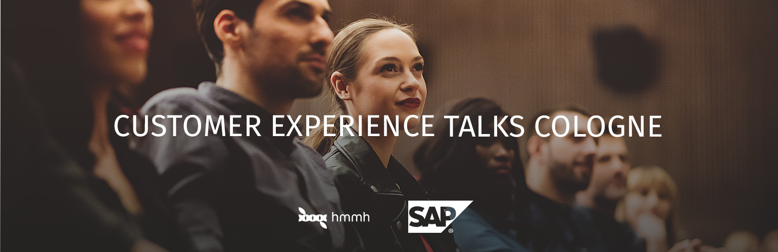 Menschen hören interessiert zu: Customer Experience Talks Cologne